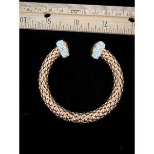 copper colored metal and rhinestone bracelet